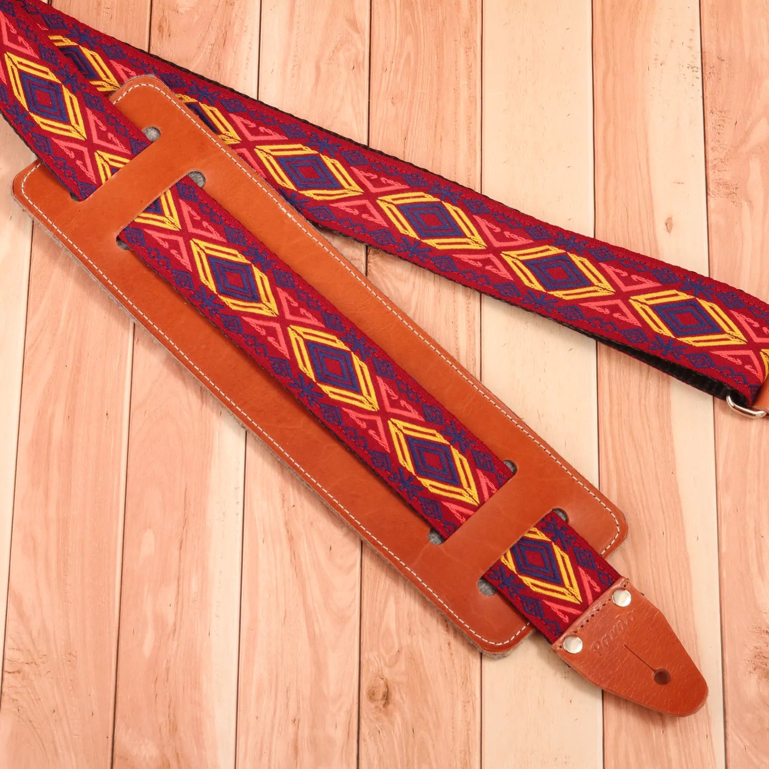 Red and yellow jacquard guitar strap for electric or acoustic guitar - paired with a leather guitar strap pad for better coverage and extra comfort