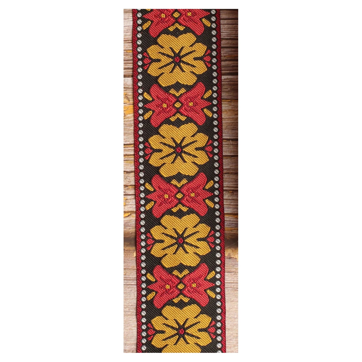 Retro Bell woven guitar strap featuring oversized mustard motifs and contrasting red bell-shaped details.