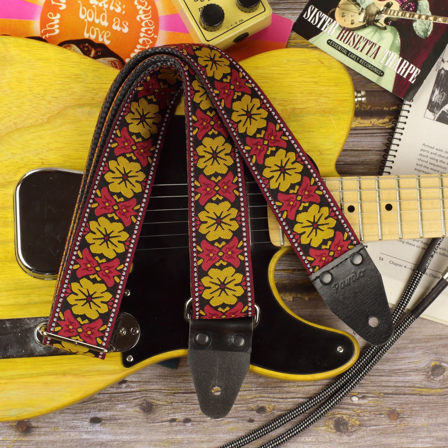 Retro Bell woven guitar strap displayed with a Fender Telecaster 52, showing the complete strap and its distinctive 1960s-inspired pattern.