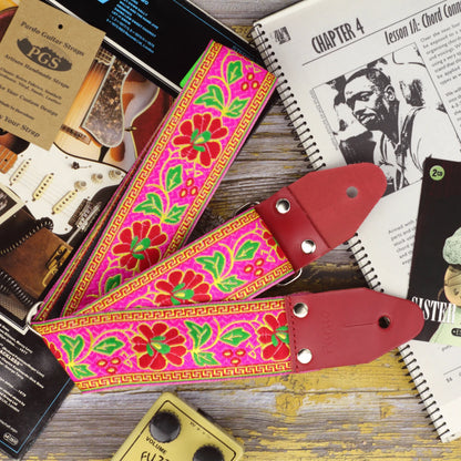 Detail of the Summer Muse woven pattern with red genuine leather ends and chrome hardware.