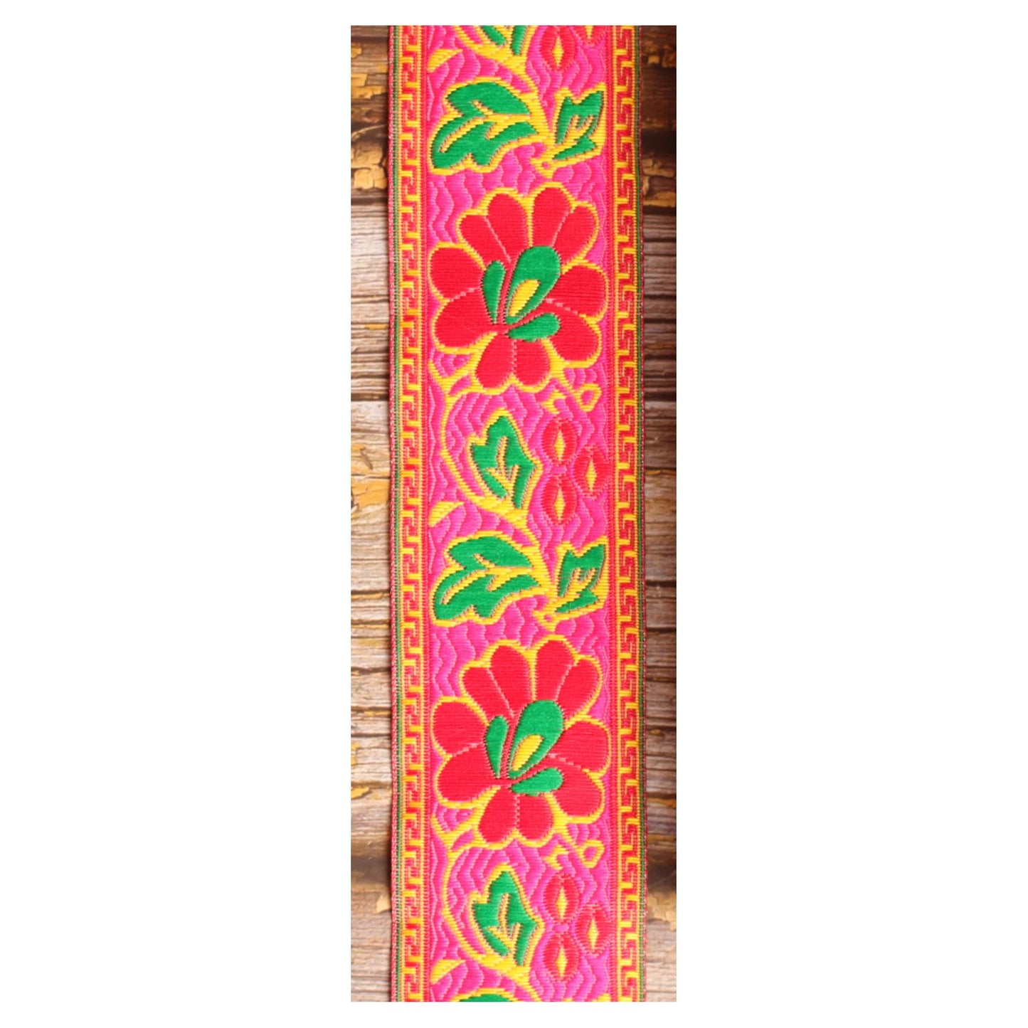 Summer Muse woven guitar strap featuring large pink motifs and a bold 1960s-inspired pattern.