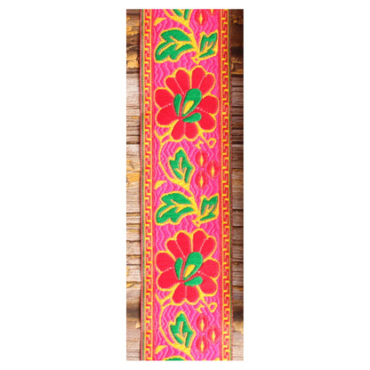 Summer Muse woven guitar strap featuring large pink motifs and a bold 1960s-inspired pattern.