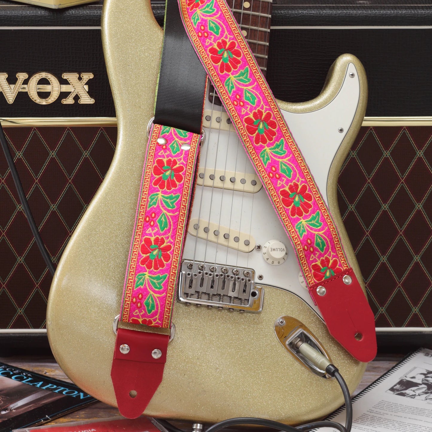 Summer Muse woven guitar strap paired with a Fender Stratocaster, highlighting its bold 1960s-inspired pattern.