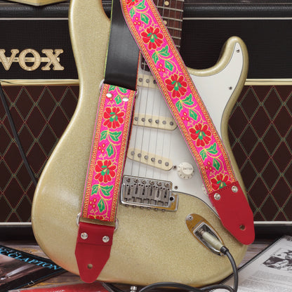 Summer Muse woven guitar strap paired with a Fender Stratocaster, highlighting its bold 1960s-inspired pattern.