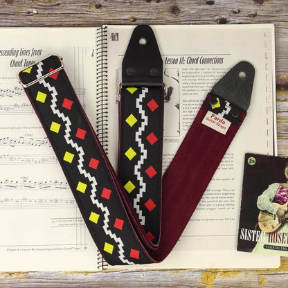 The Diamonds famous guitar strap inspired by George Harrison's strap, shown with customizable suede backing.