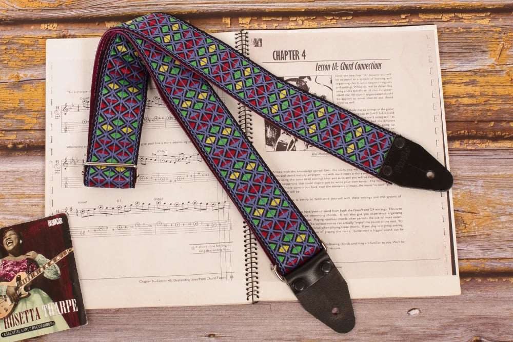 geometric woven jacquard guitar strap with blue and multicolor patterns