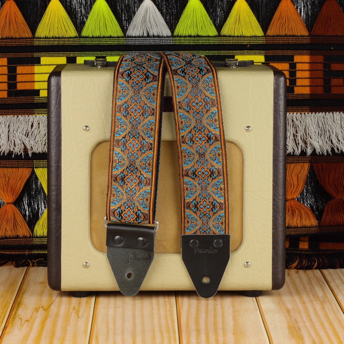 Red Horizon wide long psychedelic guitar strap in red and brown tones with Fender Champion 600 amplifier