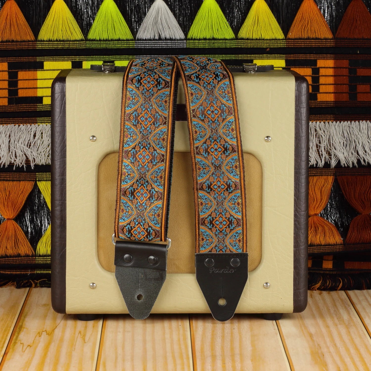 Red Horizon wide long psychedelic guitar strap in red and brown tones with Fender Champion 600 amplifier