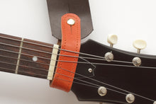 Headstock, tie for hang the guitar with a guitar strap, some colors available. Frontside leather, backside suede.
